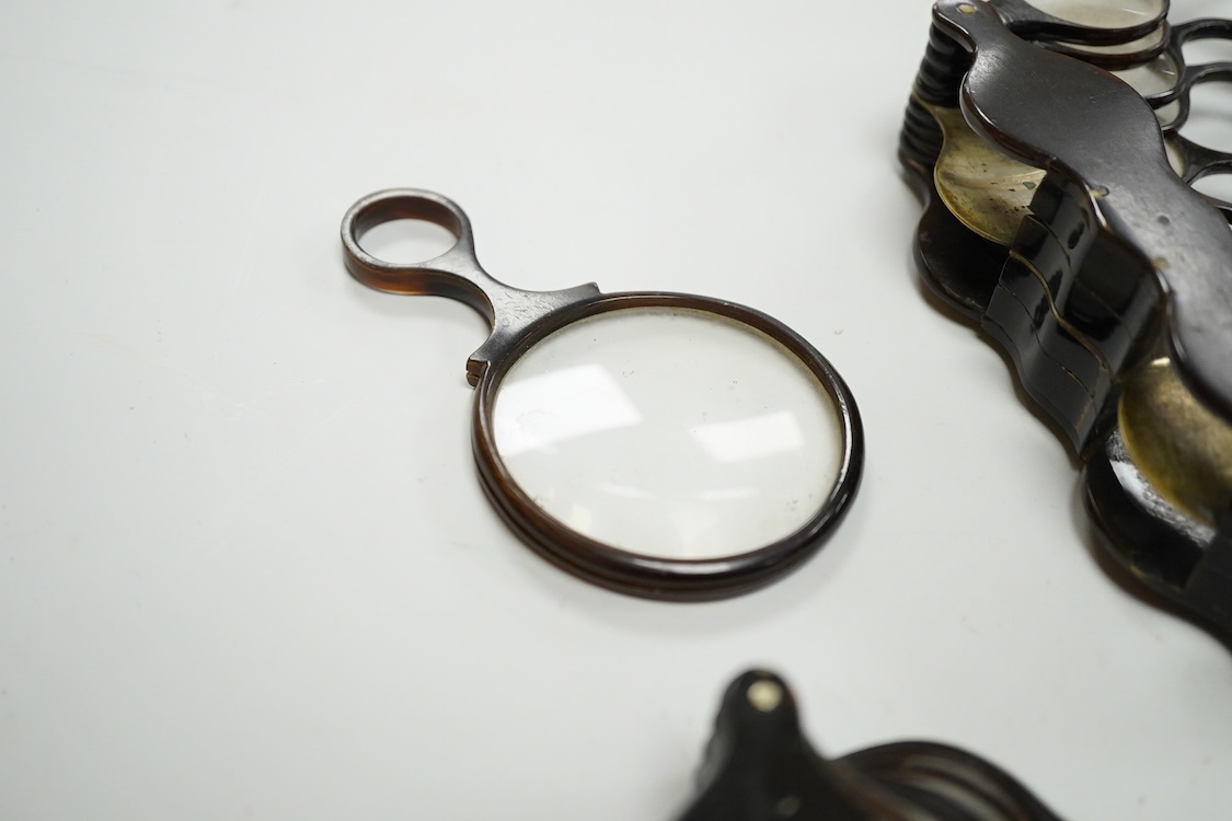 A group of 19th-century horn framed loupes, quizzing glasses and four optician multiple lens sizing lorgnettes (13)
